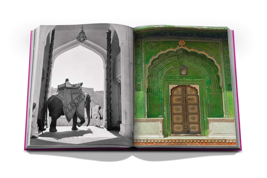 Assouline Jaipur Splendor coffee table book displaying photo of The City palace Green door & Elephants at the gates of Amber Palace, on the outskirts of Jaipur, 1940 on a white back ground available at Spacio India for luxury home decor accessories collection of Travel Coffee Table Books.