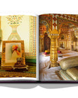 Assouline Jaipur Splendor coffee table book displaying photo of Peacemaker Chandra Mahal Jaipur Palace & A portrait of Maharaja Sawai Man Singh of Jaipur in the private quarters of the City Palace on a white back ground available at Spacio India for luxury home decor accessories collection of Travel Coffee Table Books.