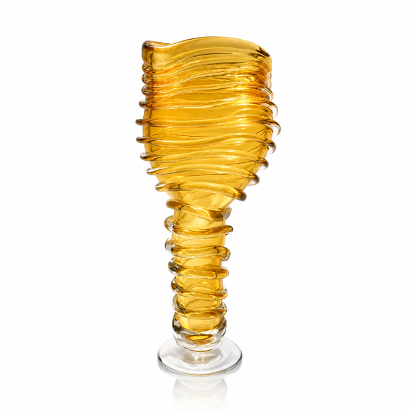 An amber yellow crystal vase with a wavy, ribbed spiral design on a white background.