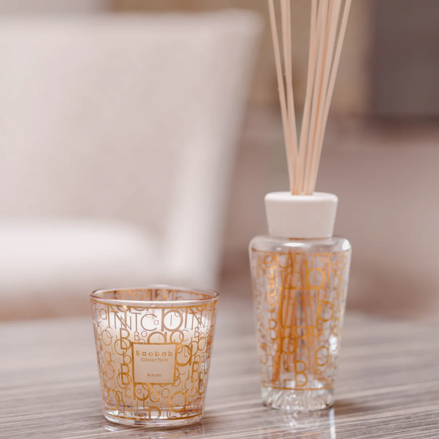 Baobab My First Baobab candle & diffuser from Aurum Gift Set on a wood table available at Spacio India for luxury home decor collection of Gift Sets of Candles & Fragrance.