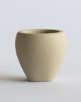 Beige FRP vase on a light gray background