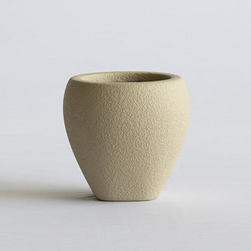 Beige FRP vase on a light gray background