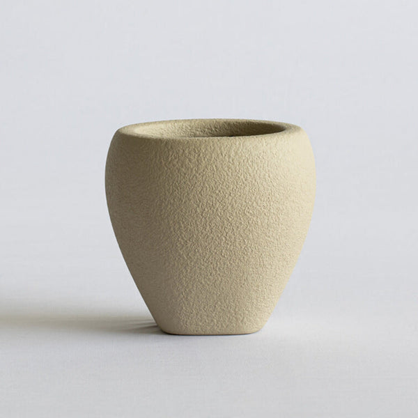 Beige FRP vase on a light gray background
