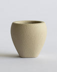 Beige FRP vase on a light gray background
