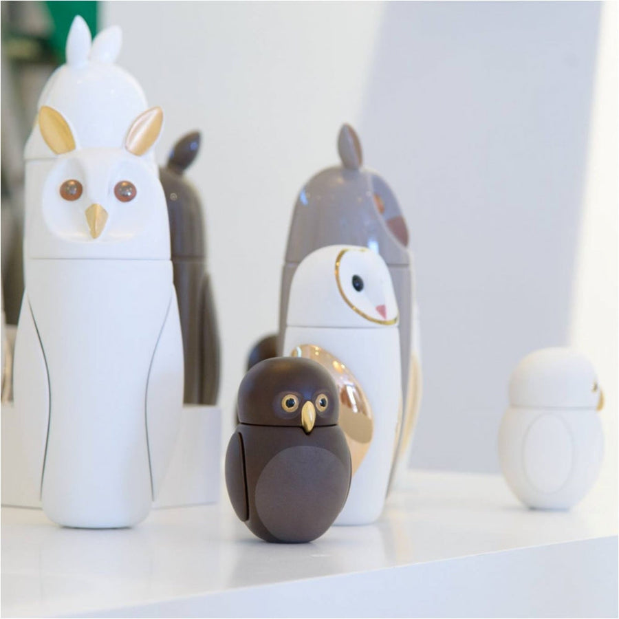 A Bosa Barns The Owl collection of owl shaped vases, including a Barn Owl sculpture, adorns a table.