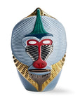 Decorative mask with geometric design on a white background