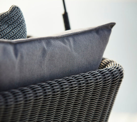 Cushion close up Cave Swing Sofa by Cane-line, designed by Jesper K. Thomsen, featuring a modern canopy design, soft cushions, and weather-resistant materials for indoor and outdoor use.