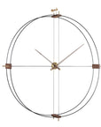 A Nomon Delmori G/F Black/A Walnut DEG000NN wall clock made of metal and wood.