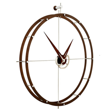 A Nomon clock with a circular design on a white background made of chromed steel.