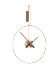 A Nomon Clock Nomon Micro Daro G Walnut MDADN hanging on a white wall in luxury interiors.