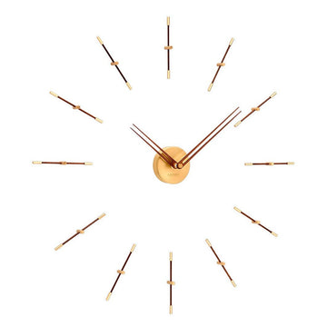 A Nomon Mini Merlin 12 Gold Walnut MMD120N wall clock with walnut wood hands and a large number of nails on it.