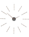 An elegant Nomon clock with metal rods on a white background.