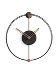 A modern Nomon Nano clock with a black and copper Nordic air design.