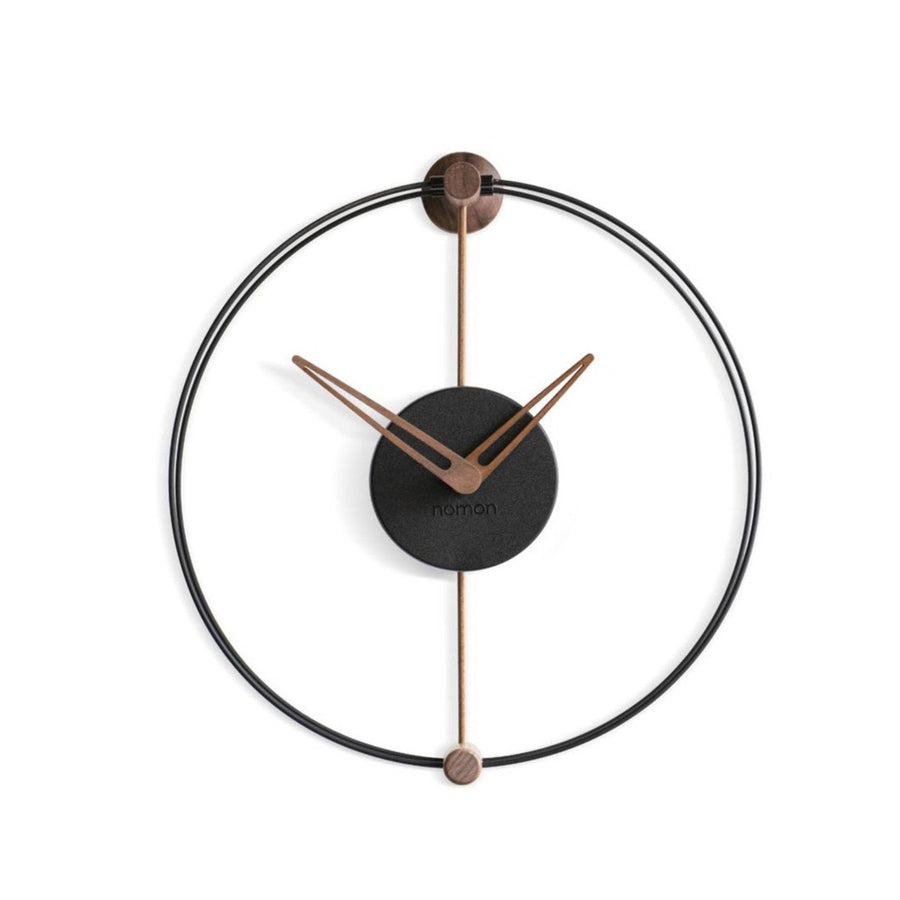 A modern Nomon Nano clock with a black and copper Nordic air design.