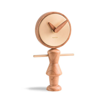 A Nomon Nena Oak and Brass NENARG wooden clock featuring a charming wooden figure on it.