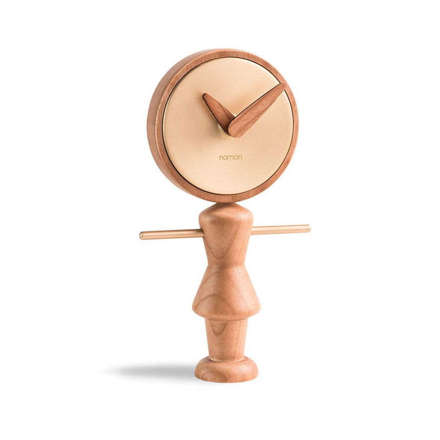 A Nomon Nena Oak and Brass NENARG wooden clock featuring a charming wooden figure on it.