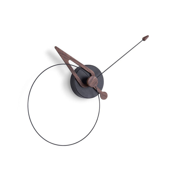 Modern wall clock with wooden hour and minute hands on a white background from Nomon available at Spacio retail stores in Mumbai & Kolkata and online. 
