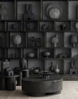 A quirky interior setting adorned with a multitude of 101Cph Cobra Double Medio Coffee 211037 vases on shelves, each uniquely hand glazed by 101 Copenhagen.