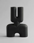 A hand glazed 101Cph Cobra Double Medio Coffee 211037 vase with a quirky curved shape, perfect for any interior setting.