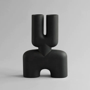 A hand glazed 101Cph Cobra Double Medio Coffee 211037 vase with a quirky curved shape, perfect for any interior setting.