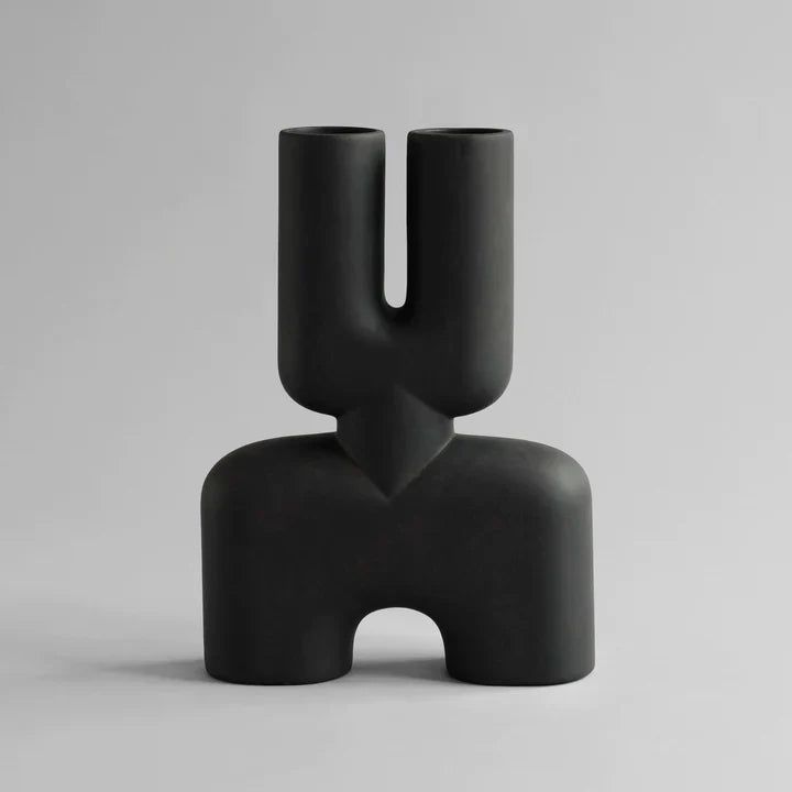 A hand glazed 101Cph Cobra Double Medio Coffee 211037 vase with a quirky curved shape, perfect for any interior setting.
