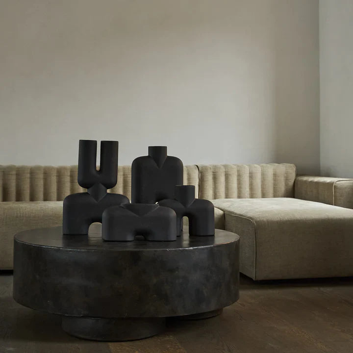 A 101Cph Cobra Double Medio Coffee 211037 coffee table in a living room with a hand glazed couch. (Brand Name: 101 Copenhagen)
