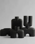 A group of quirky, hand glazed 101Cph Cobra Double Medio Coffee 211037 vases on a white background from the brand 101 Copenhagen.