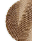 Close-up of a textured brown circular wall art on a white background