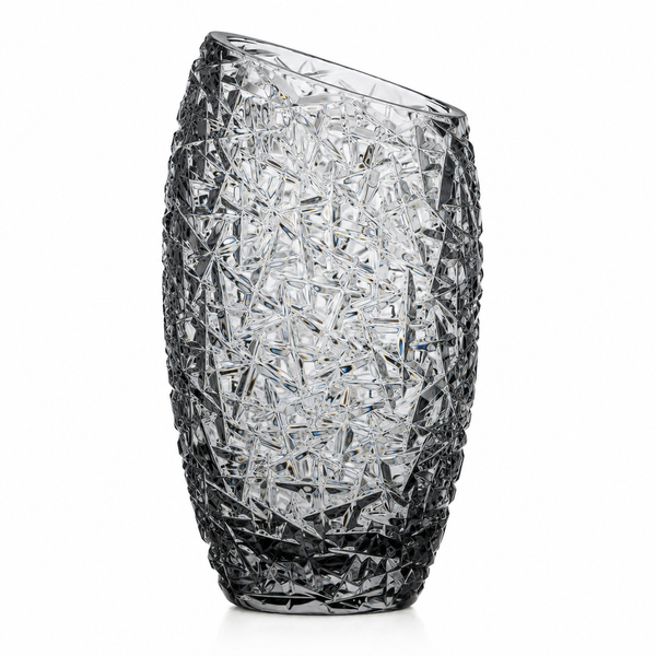 A clear cut-crystal vase with an asymmetrical, slightly slanted top and a textured, faceted pattern, shown on a white background.
