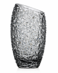 A clear cut-crystal vase with an asymmetrical, slightly slanted top and a textured, faceted pattern, shown on a white background.