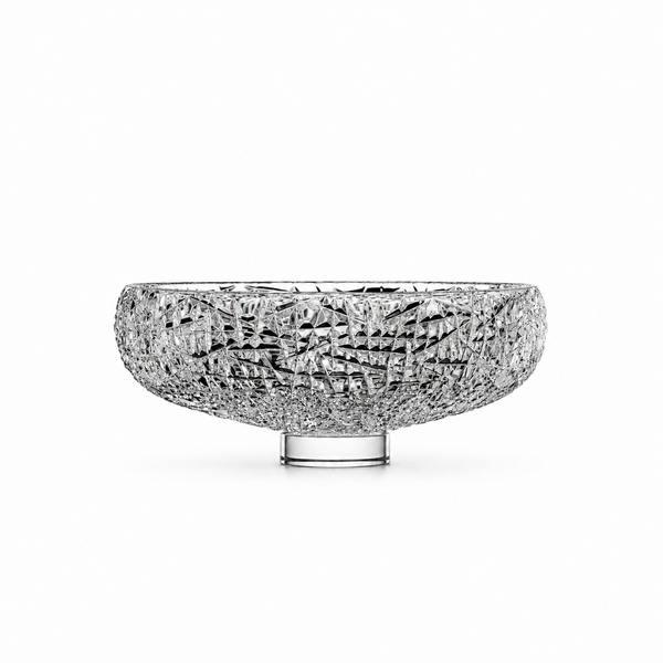A clear crystal cu bowl with a faceted, mosaic-like surface against a seamless white background.