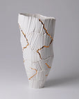 The Fos Ceramiche Meltemi Vase showcases Fos Ceramiche craftsmanship with its elegant design and gold cracks, exuding luxury and artistry.