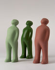 Three Gardeco Ceramic Sculpture Visitor Small Pau Brazil Clear Cor39 figurines, standing next to each other, attracting visitors with their vibrant colors.