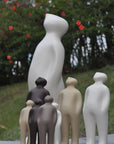 A group of Gardeco Ceramic Sculpture Visitor Small Dune Cor47 figurines standing next to each other showcasing exquisite craftsmanship.