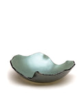 A Gardeco Glass Bowl Mapa 30 Verde with a black rim, created by a Brazilian artist.