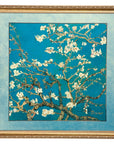 Framed limited edition artwork of a floral branch with white flowers on a blue background by the famous artist Vincent Van Gogh, signed 'Vincent', available at Spacio in India. 