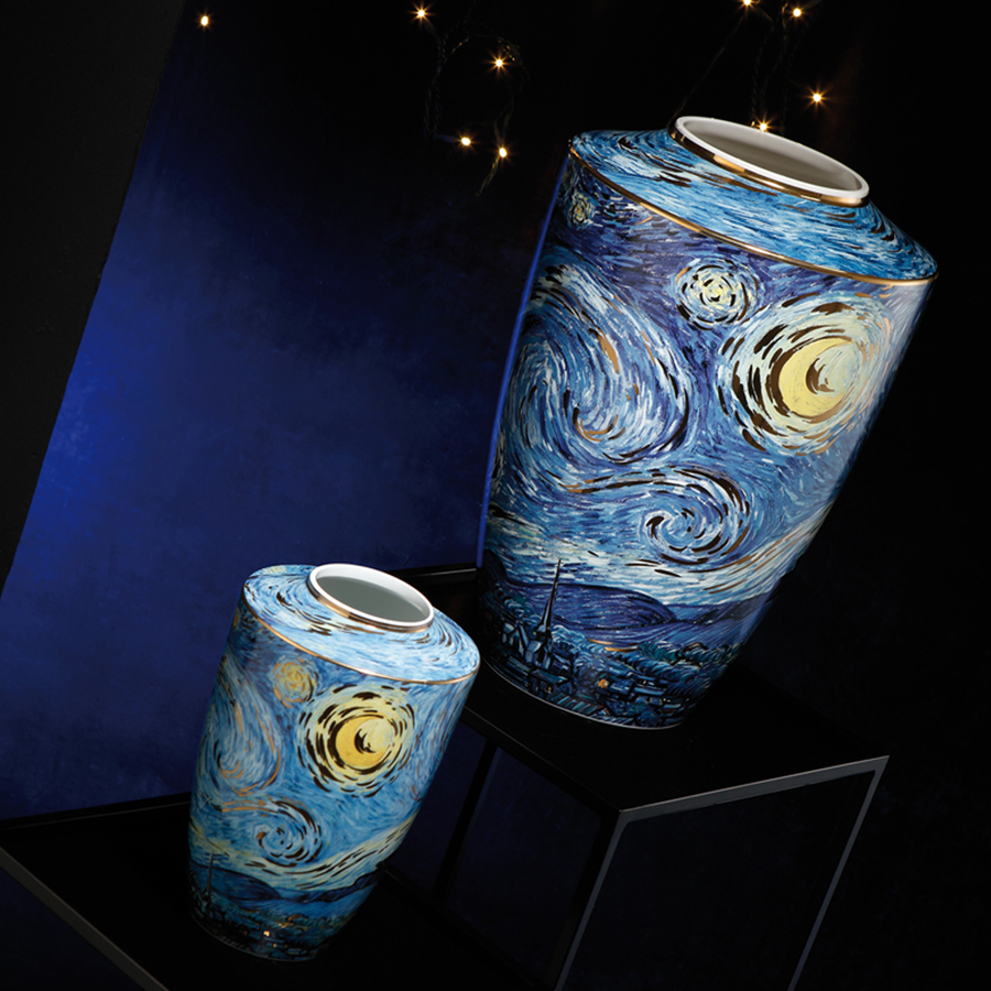 A pair of Starry Night Porcelain Vase Limited Edition by Vincent van Gogh on a pedestal against a dark blue back ground with lights available at Spacio India from the heirloom collection of Luxury Home Decor Accessories