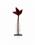 A red flower sculpture from Habrat on a white background available at Spacio in India. 