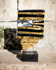 Decorative glass sculpture on an earthy background