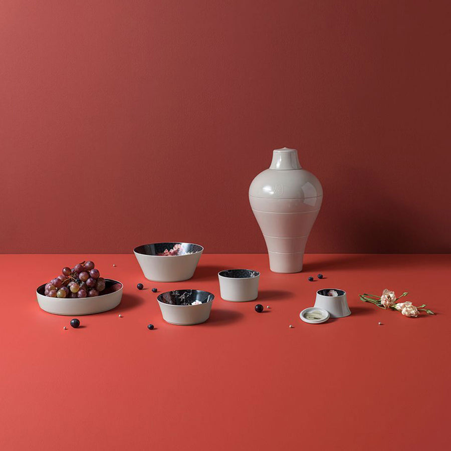 Ibride Ming Lin Muse seven pieces stackable set on a red table surface with other food ingredients available at Spacio India for luxury home decor of collection Tableware Accessories 