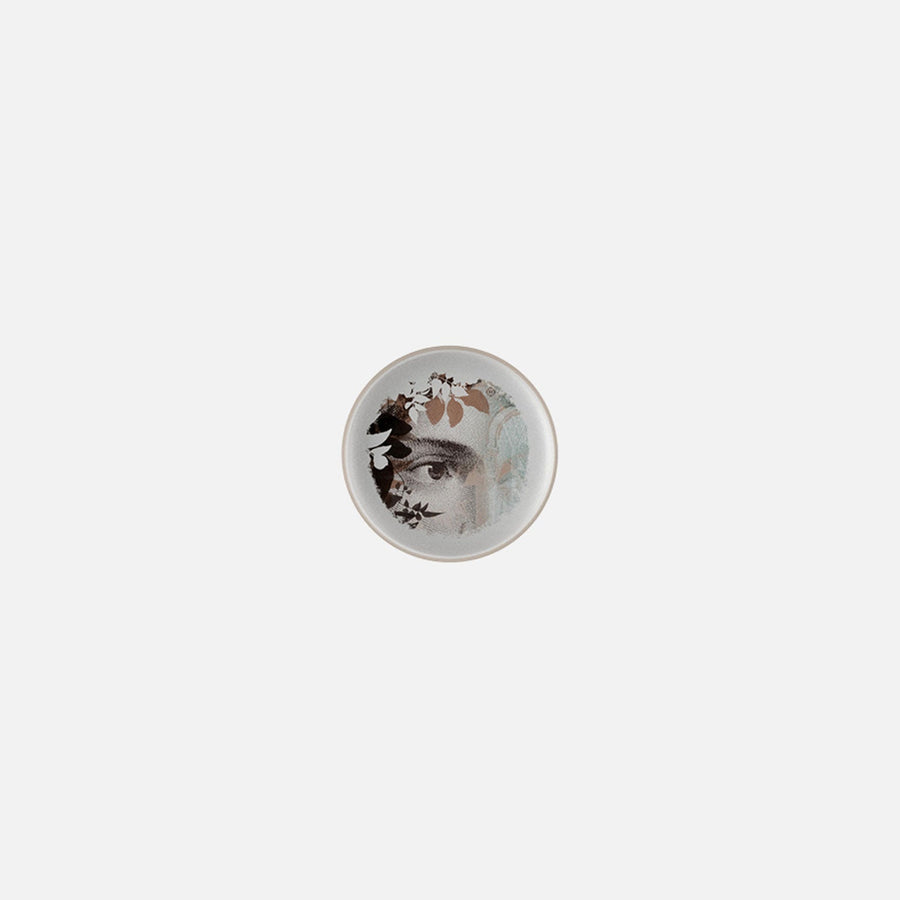 Small plate with leaves & eye art on it from Qing Alhambra Rose stack set on a white back ground available at Spacio India for Luxury Home Decor Collection of Tableware Accessories