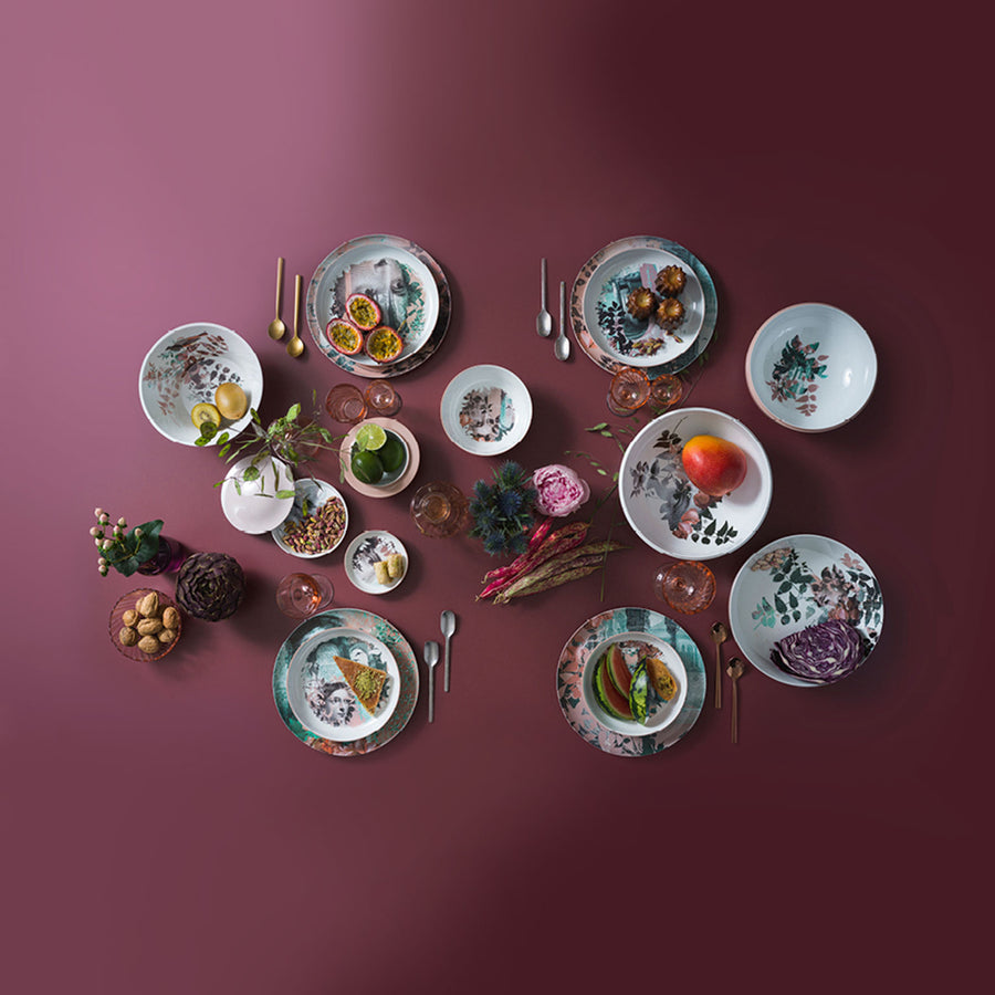Qing Alhambra Rose stack set laying on dining table with other cutlery & kitchen accessories with food ingredients available at Spacio India for Luxury Home Decor Collection of Tableware Accessories