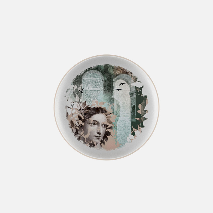 Plate with leaves, flowers & ancient human face art on it from Qing Alhambra Rose stack set on a white back ground available at Spacio India for Luxury Home Decor Collection of Tableware Accessories