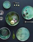 Ibride Yuan Noir Narcisse Stack table set on a table with cutlery & some food ingredients available at Spacio India for home decor collection of Tableware Accessories