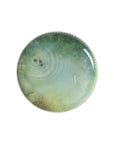 A plate from Ibride Yuan Noir Narcisse Stack table set containing a print woman face & a boat available at Spacio India for home decor collection of Tableware Accessories