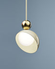 A versatile and vibrant lighting design from the Aurora Collection by Italamp featuring brushed gold accents, white glass diffuser, and retro-inspired finishes. A closeup view of the ivory finish pendant lamp in smaller size