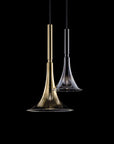 Baffo Collection by Italamp with conical design, titanium finish glass, and matching metal accents, showcasing Italian craftsmanship and elegance. A pair of baffo pendant lights in gold and titanium finish on a black background