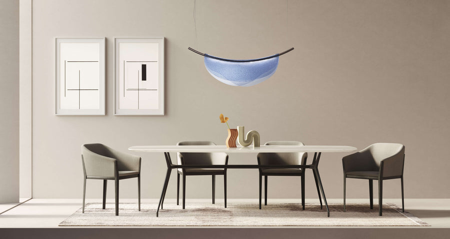 A modern dining room with an Italamp Dali pendant light and an Italamp table with chairs.
