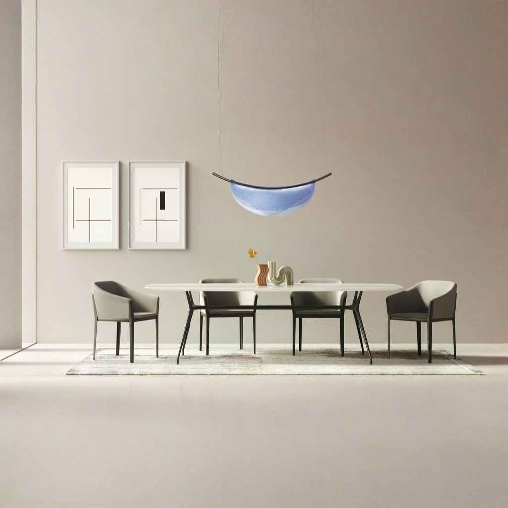 A modern dining room with an Italamp Dali pendant light and an Italamp table with chairs.