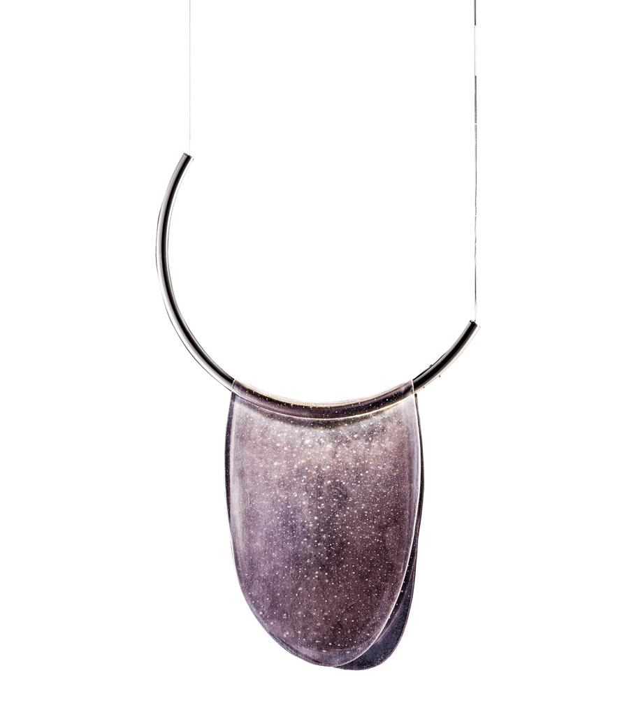 An Italamp Dali pendant necklace with a curved shape hanging on a black background.